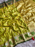 Premium silk parrot green saree and evergreen border of triangular temple style design with blouse