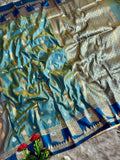 A beautiful peacock green silk saree with tale blue boarder of temple style motifs   with blouse