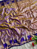 A gorgeous lavender purple soft silk saree of striking deep royal violet boarder and triangular temple style motifs Of gold and silver florals with blouse