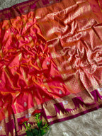 Coral orange premium soft silk saree of berry magenta triangular temple style motifs beneath the floral panels with blouse