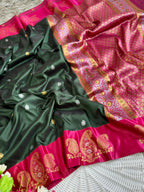 Emerald green soft silk saree with rani pink border of mango jelly design antique gold zari with blouse