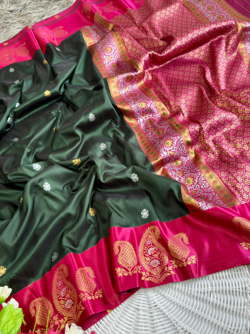 Emerald green soft silk saree with rani pink border of mango jelly design antique gold zari with blouse