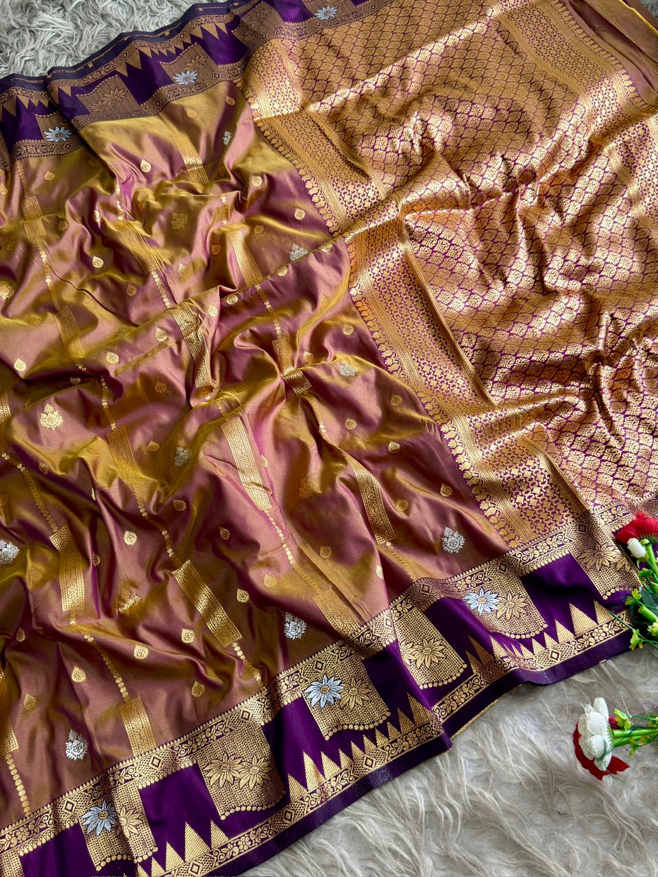 Dusty muvua burgandy premium soft silk saree with warm antique gold sheen of triangular temple style motifs with blouse