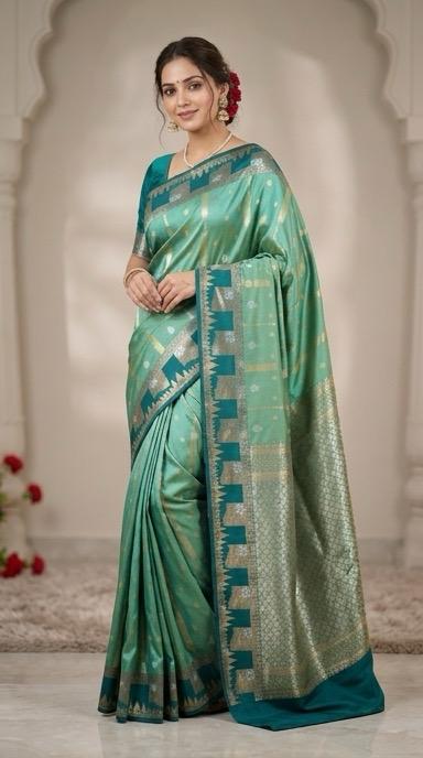 A refreshing aqua mint green premium soft silk saree  with a contrasting peacock tale boarder of large floral panels with blouse