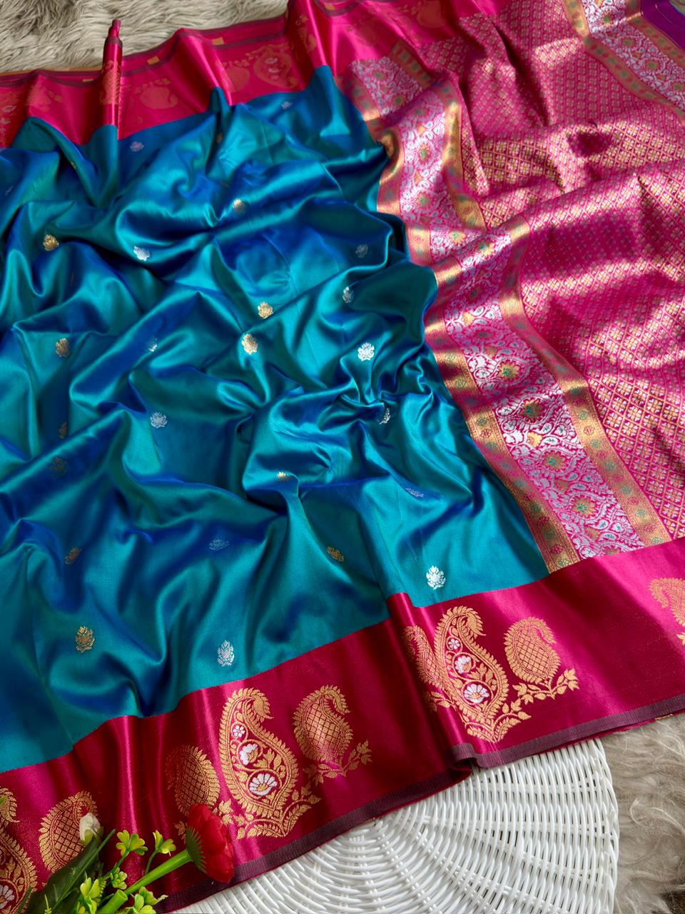 Peacock blue soft silk saree with rani pink border of mango design golden zari with blouse